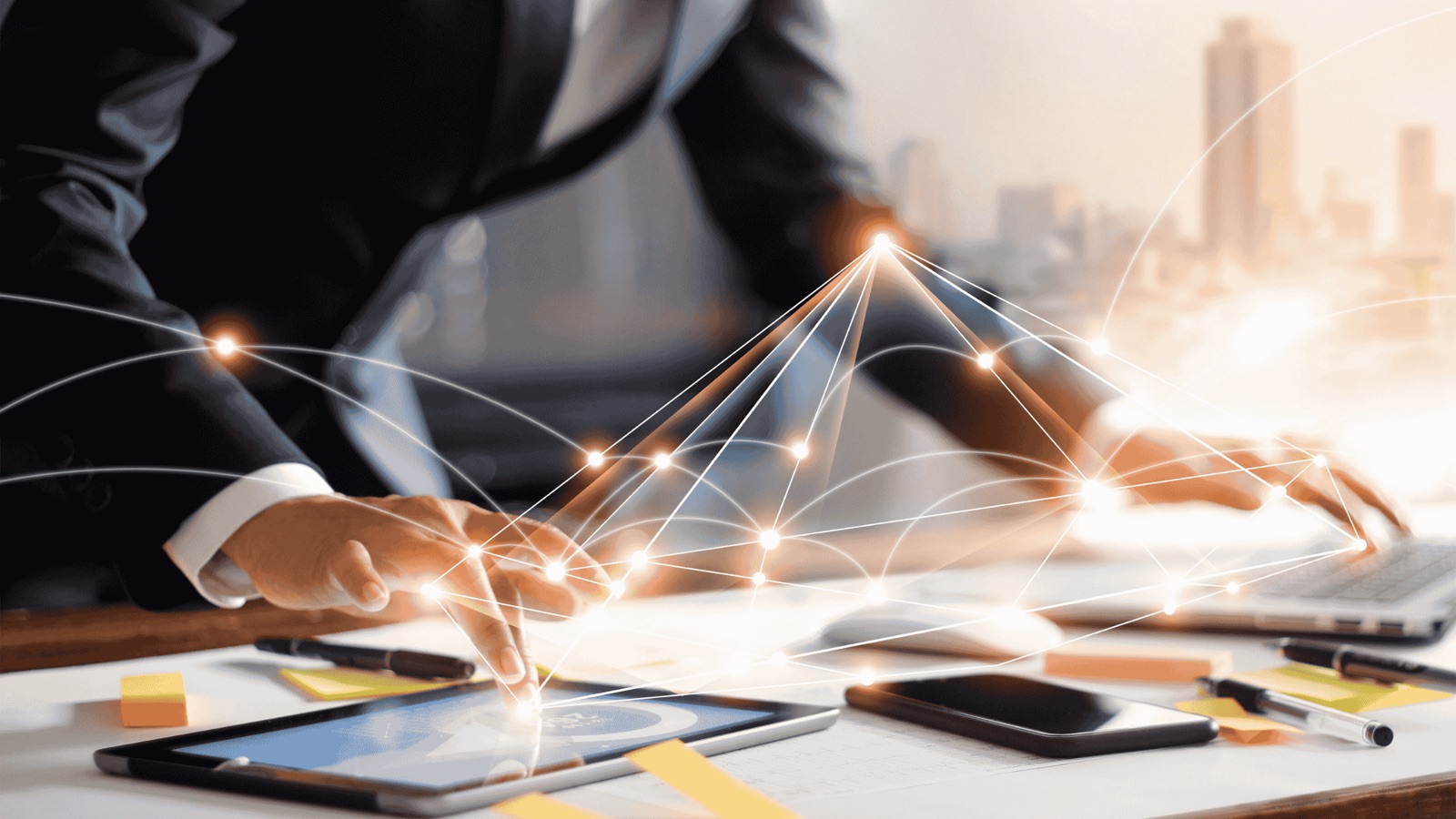Business professional working with digital devices connected by network lines